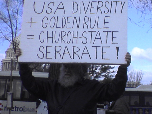Friend, Bill, holding sign